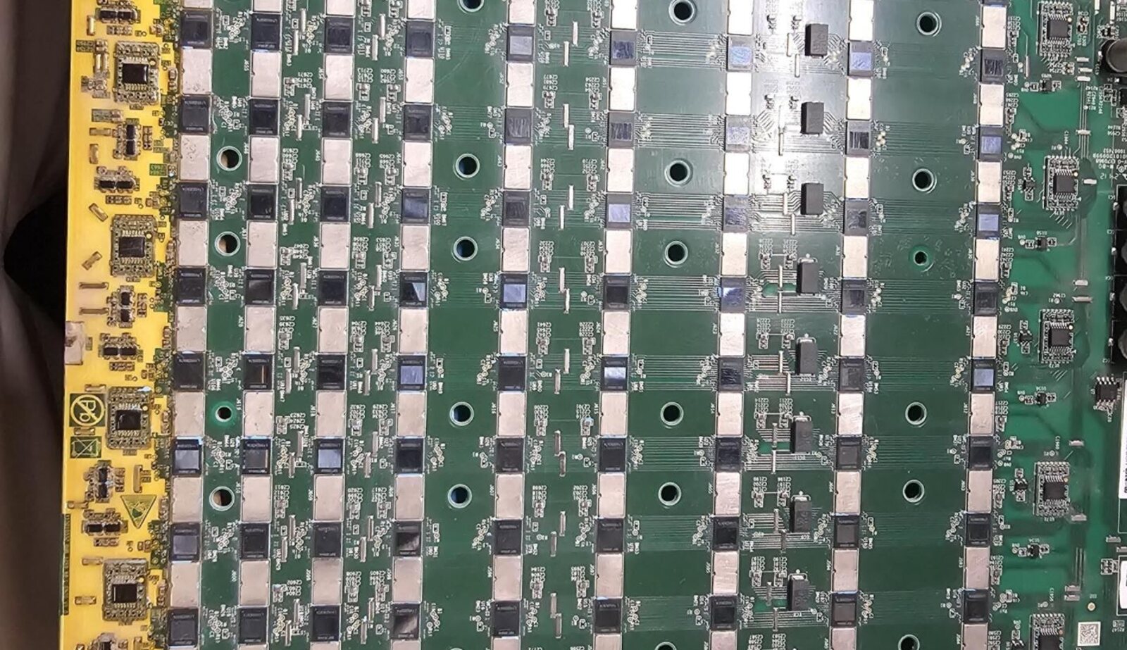 ASIC hashboards laid out for diagnosis and repair at the Astro Solutions lab near Midland Texas